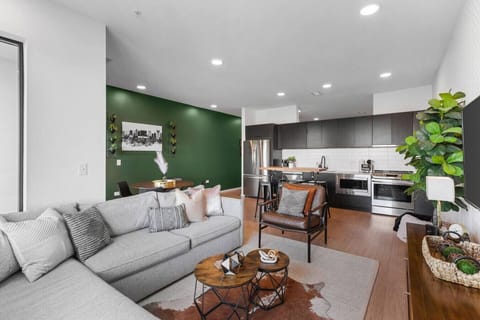 Spacious living room with queen pull-out couch, stunning riverfront views, and a Smart TV for your entertainment. Enjoy your morning coffee on our private patio that overlooks Cumberland river.