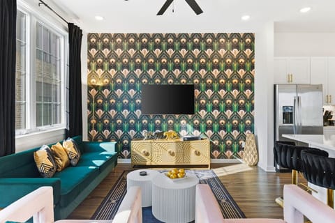 Spacious, stylish living room with a Smart TV and comfortable new furnishings for you to relax. Bar cart to make your favorite cocktail!