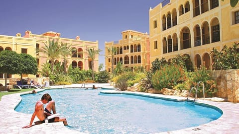 Enjoy a refreshing dip in the communal pool seconds away from the apartment. 