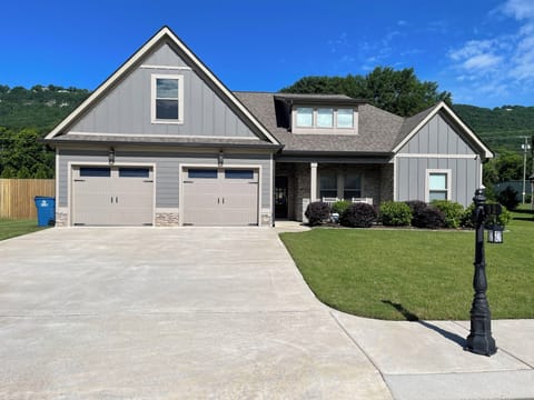 Front view of the house with parking for 4 vehicles & is wheelchair accessible.
