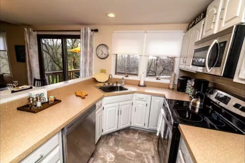 kitchen has the essentials...cookie sheets, wine glasses and a ton of mugs!