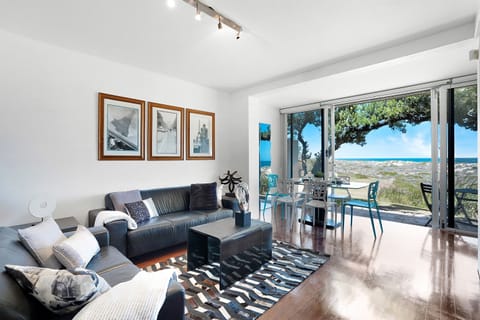 Open-plan lounge and dining with stunning sunset views