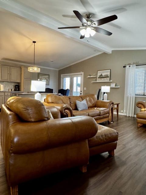 Welcome to the living room where the furniture practically begs you to relax.