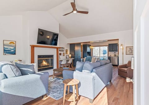 Unwind in the inviting living room, complete with a warm fireplace and a TV—perfect for spending quality time with family or friends.