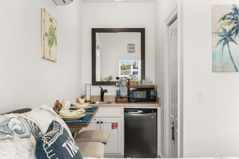 Kitchenette with mini fridge, microwave and coffee maker