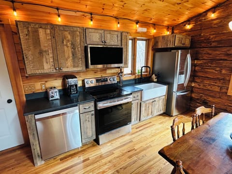 Newly renovated kitchen with updated appliances, cabinets, and countertops