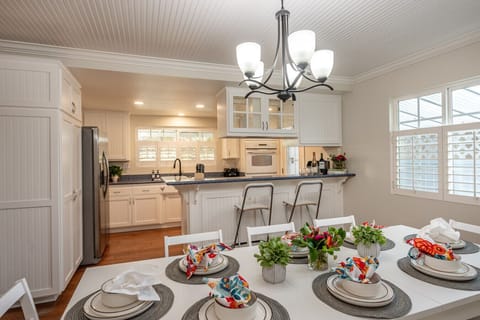 Another view of the dining room and kitchen