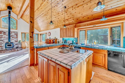 Kitchen: Drip coffee maker, espresso machine, cooking utensils, tableware, main floor