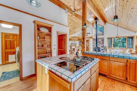 Kitchen: Drip coffee maker, espresso machine, cooking utensils, tableware, main floor