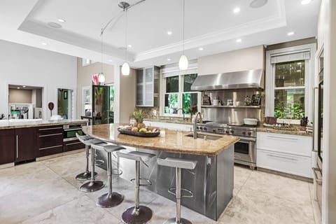 Chef’s kitchen with dual islands, gas stove, and seating for your entire group.