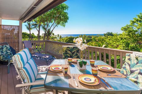 Enjoy quiet outdoor dining with partial ocean views on your private lanai