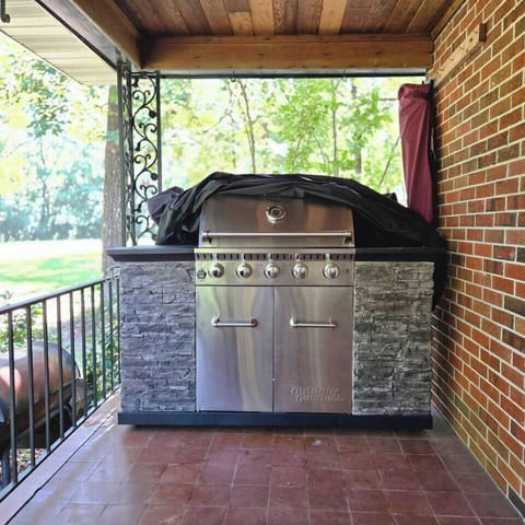 The gourmet grill is just steps away from the side door to the kitchen. 