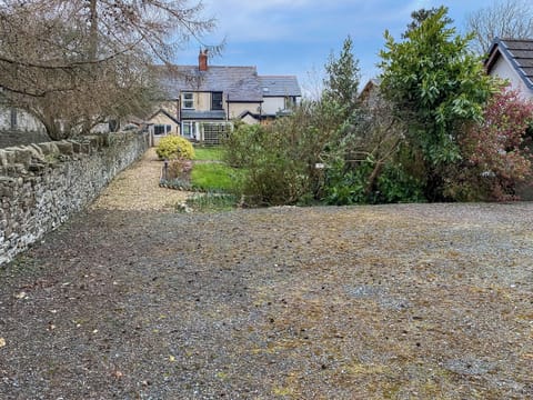 Parking area and rear garden | Bryn View Villa, Bryn Y Maen