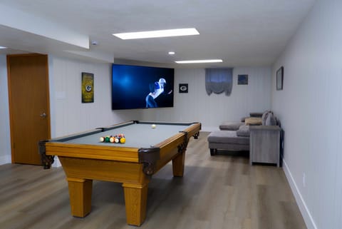Basement Pool Room with 75in TV, Fridge, and Bar