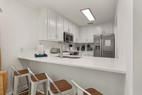 Spacious kitchen with seating at the bar