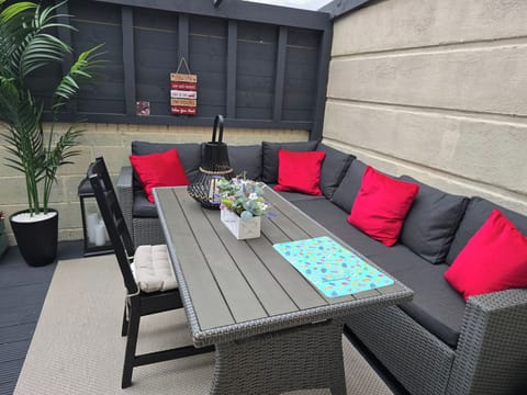 A stunning sunroom / patio with outdoor furniture