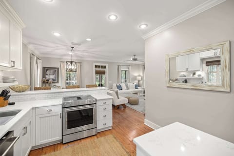 Kitchen: Stainless steel appliances, drip coffee maker, cooking utensils, tableware