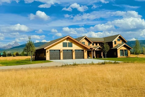 With a chic mountain-modern design to complement useful amenities, such as a spacious three-car garage, this home has plenty to offer any group.