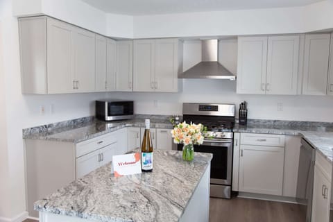 Kitchen- Bright and updated kitchen space with ample prep area and natural light.