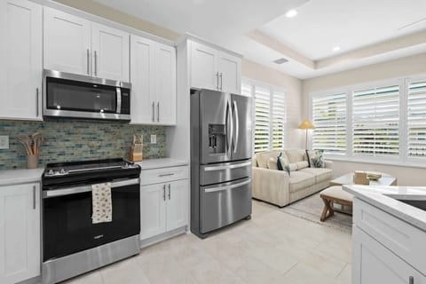 toaster oven, baking supplies, crockpot and large casserole/serving dishes