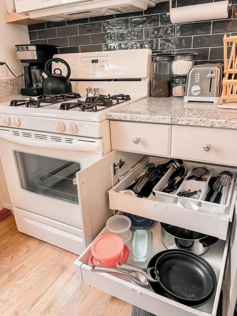 Fully stocked kitchen drawers for a hassle-free cooking experience.