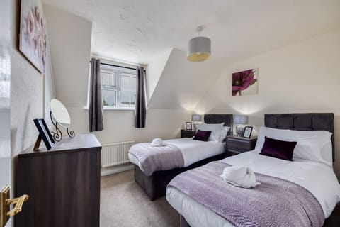 Bedroom 1: Zip-link bed set up as two single beds by default or can be zipped together as a king-size bed upon request.