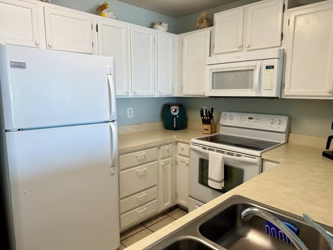 There is an air fryer and full size appliances.