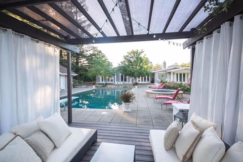 Luxury meets relaxation in this private poolside cabana! Lounge in style with cozy seating, flowing curtains, and serene views for the ultimate outdoor escape.