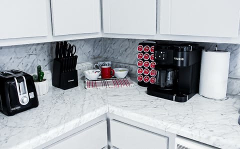 Kitchen with counter top appliances. Great Coffee Bar