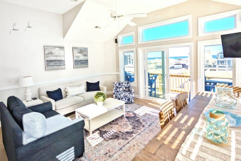 Bright coastal retreat with stunning views, steps to the beach and sunny deck!