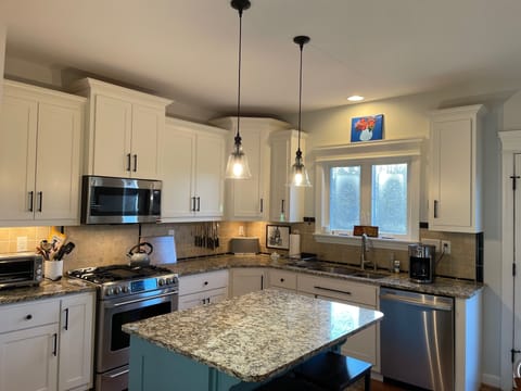 Kitchen with island and barstools