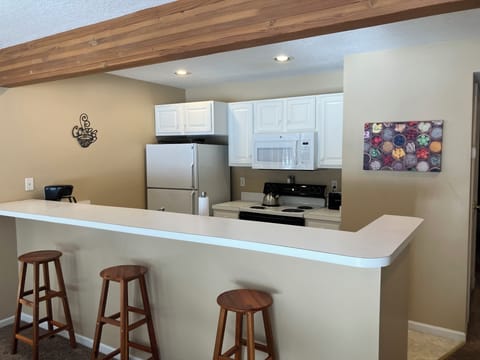 Fully Stocked Kitchen with bar height counter & 3 bar stools 