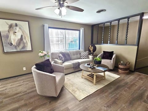 This beautifully designed living room features a spacious full size sofa bed. 