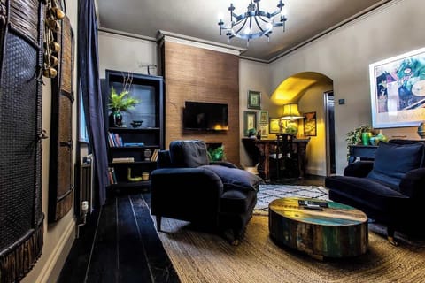 A livingroom with 2 comfortable sofas and TV.