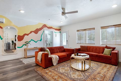 Ready for a retro escape? Funky 70s-inspired living space with a bold mural!