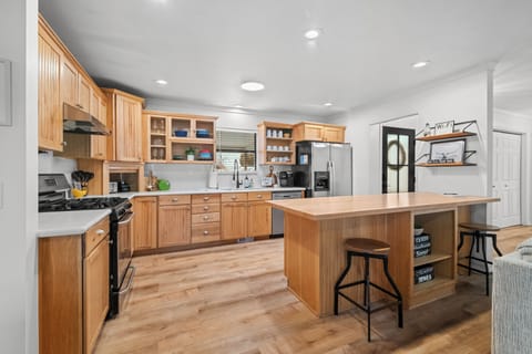 Front entry leads into open concept kitchen, living, & dining! Pantry in hall!