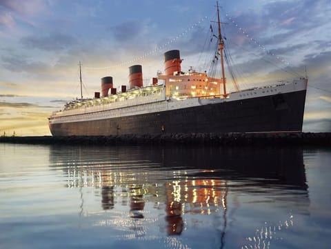 Step aboard an iconic liner glowing beautifully at sunset.