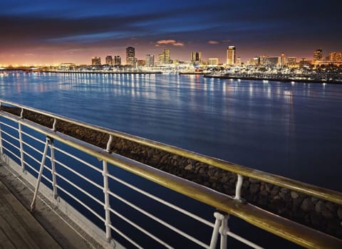Unwind at dusk with sweeping skyline views over water.