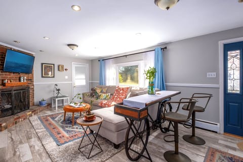 1st level living room. Has Roku TV, books, board games, and unique arts.