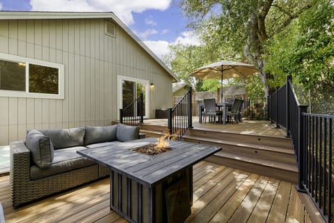 Firepit surrounded by comfortable outdoor patio seating