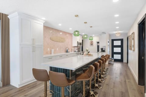 Massive Open Kitchen with 15-foot Quartz Island (seating for 12), Luxury GE Cafe Appliances. Fully stocked for large group, Games, Open to Living Room