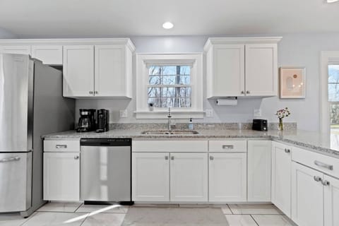 Bright, spacious, and well equipped-- this kitchen is the perfect place to cook relax, and enjoy your stay!  Has a dishwasher for added convenience. 