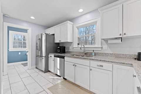 Bright, spacious, and well equipped-- this kitchen is the perfect place to cook relax, and enjoy your stay! 