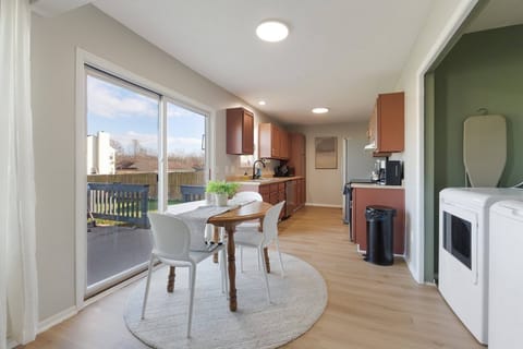 Enjoy cozy meals and good company in this charming dining space, perfect for 3 and just steps from the kitchen. 