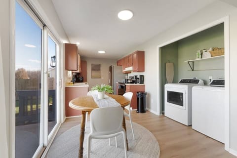 Enjoy cozy meals and good company in this charming dining space, perfect for 3 and just steps from the kitchen. 