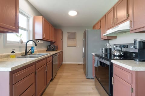 Cook up a feast or enjoy a quick bite in this fully equipped kitchen- everything you need for a delicious stay.