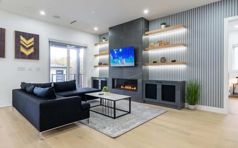 Unwind in this elegantly designed living room, where modern luxury meets comfort. Featuring a sleek fireplace, curated decor, and a state-of-the-art smart TV, it’s the perfect space to relax and recharge in style.