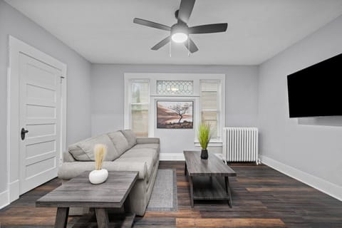 Inviting living room space with a large TV and plenty of room for relaxation