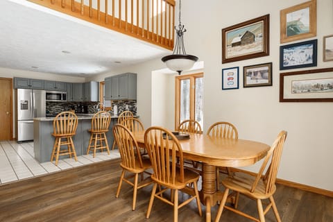 Open dining area flows into the kitchen, making it easy to gather, cook & connect in one inviting space.