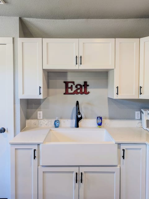 Farmhouse sink makes washing up easy before and after dinner.